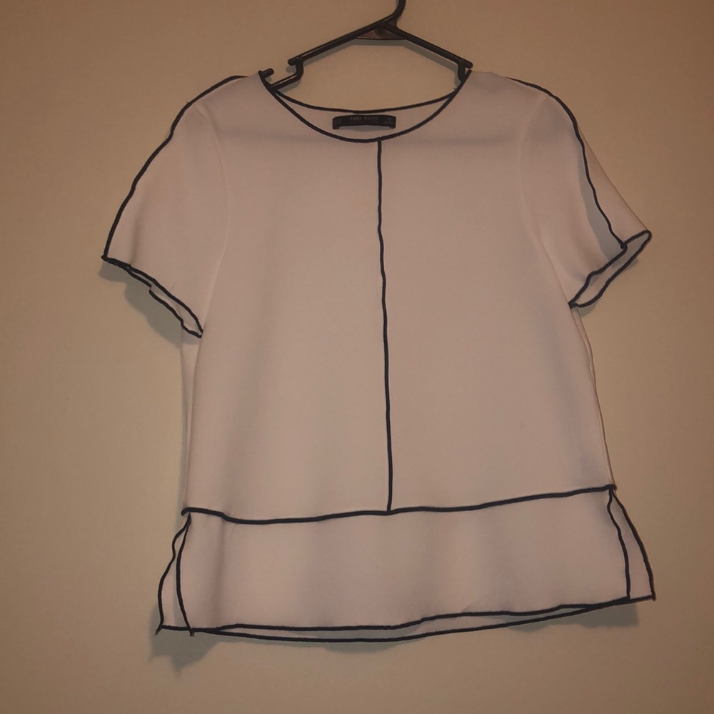 White blouse with black trim